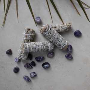 Sage smudge stick with Amethyst crystals.